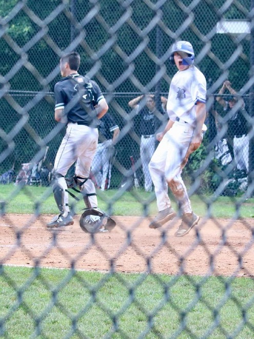 Spencer Dessart scores one of the tying runs in the postponed game against Pleasantville